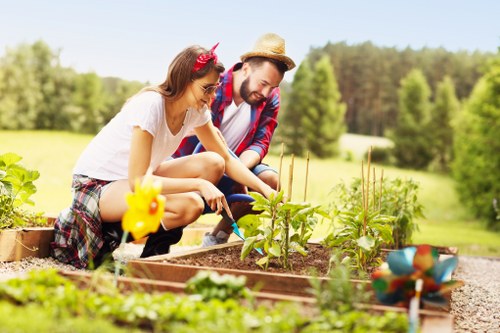 Team of gardeners conducting site safety checks and planning in a backyard