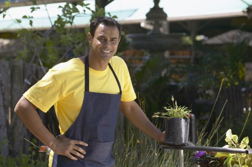 Professional landscaper working in a Rotherhithe garden
