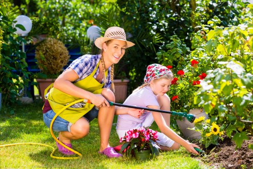 Professional gardener maintaining a garden in Rotherhithe